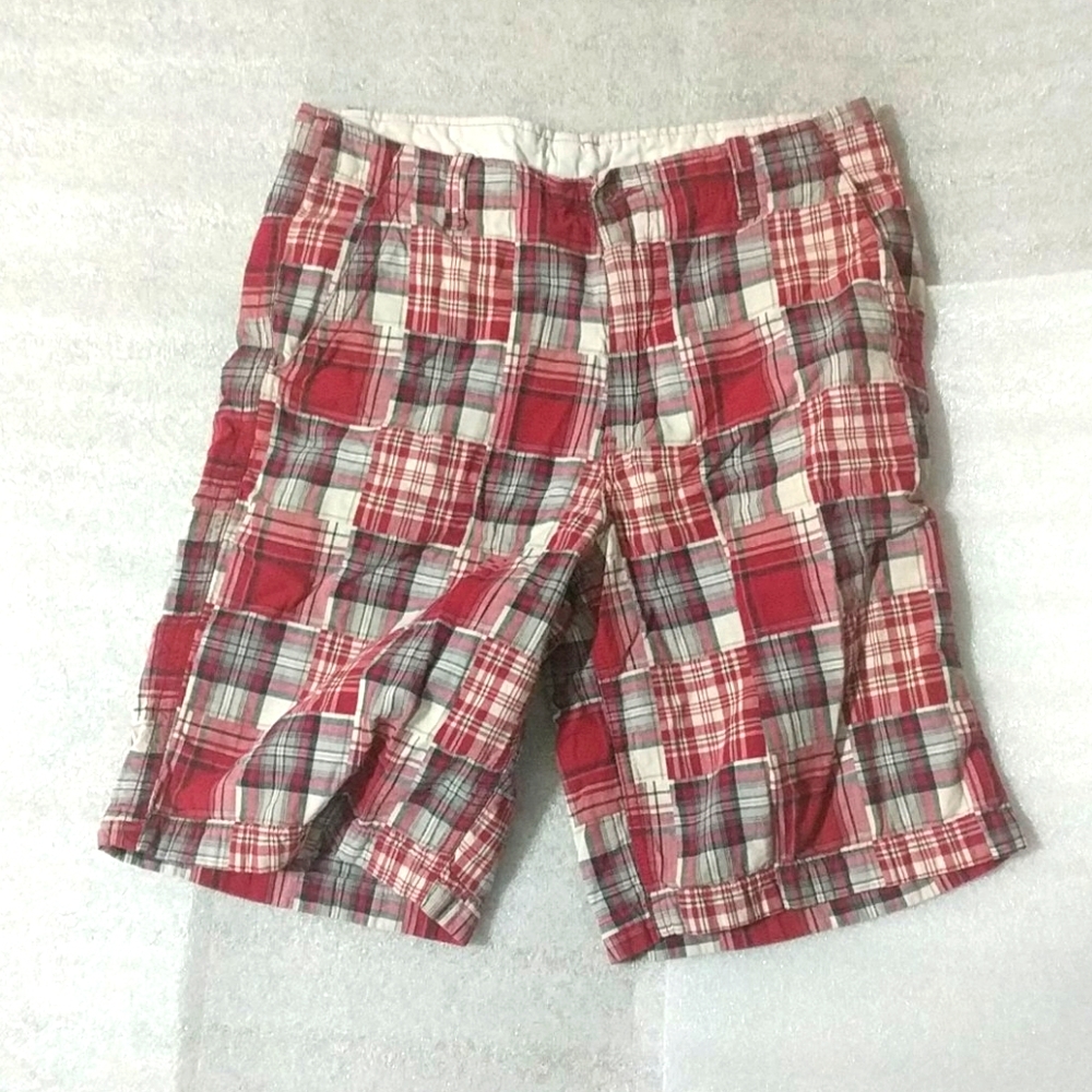 Mens red and white plaid shorts worn